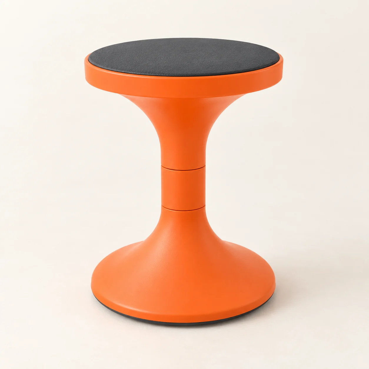 Orange child-sized C18 wobble stool with a black round seat