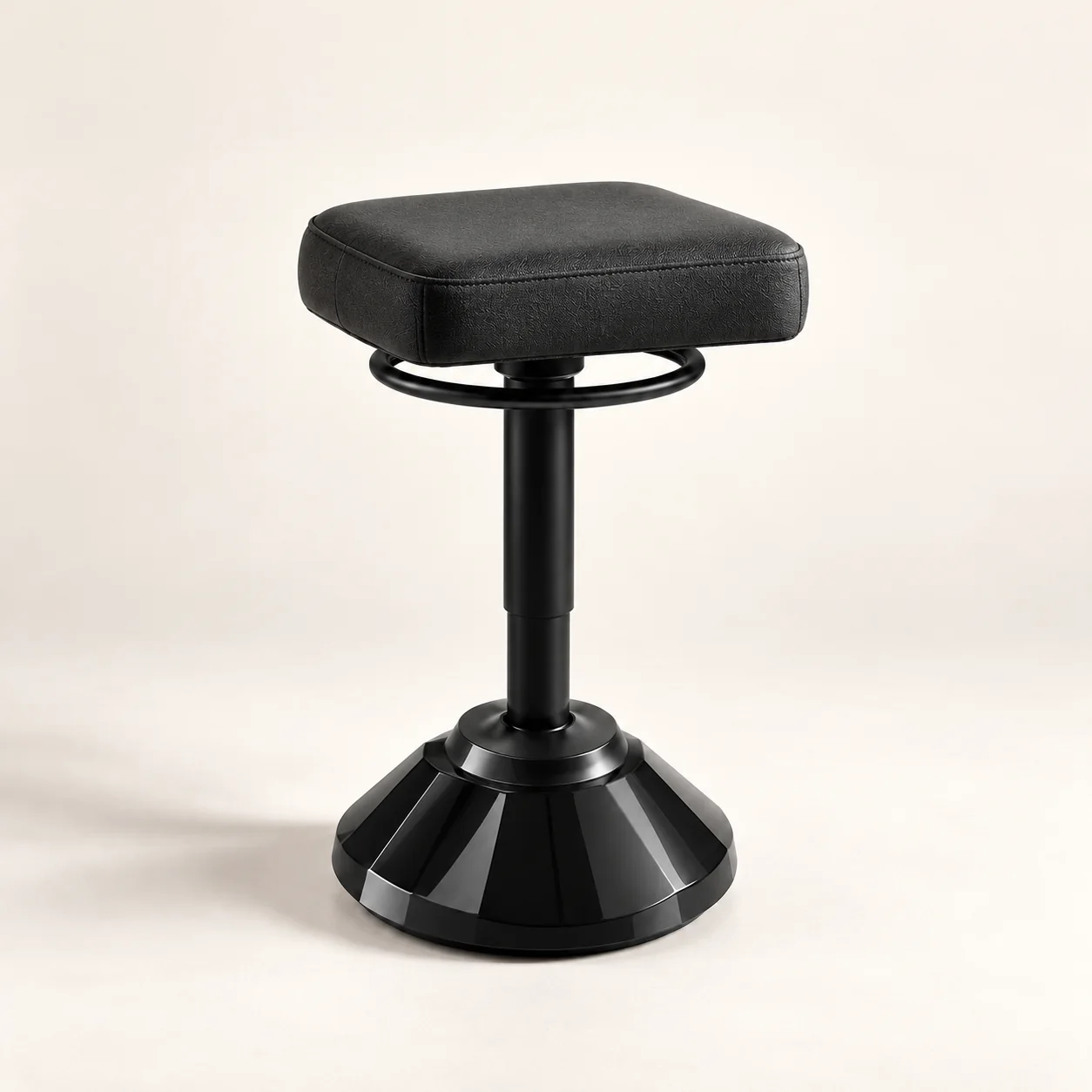 Black C03A stool with rectangular cushioned seat and faceted base